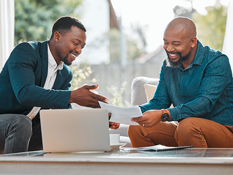 Broker, contract and black man in a house with a client for meeting or consultation for advice. Financial advisor with male person to talk about investment, savings plan or budget and insurance paper.